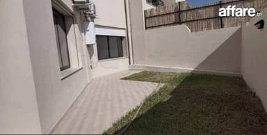 ENNASR 2 – Élégant Appartement S+2 avec Jardin Privatif