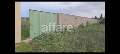Un terrain de1000 m2 sur la route principale