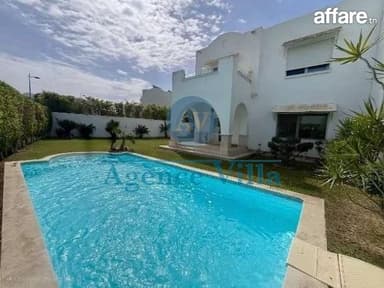  une villa avec piscine et jardin à Gammarth